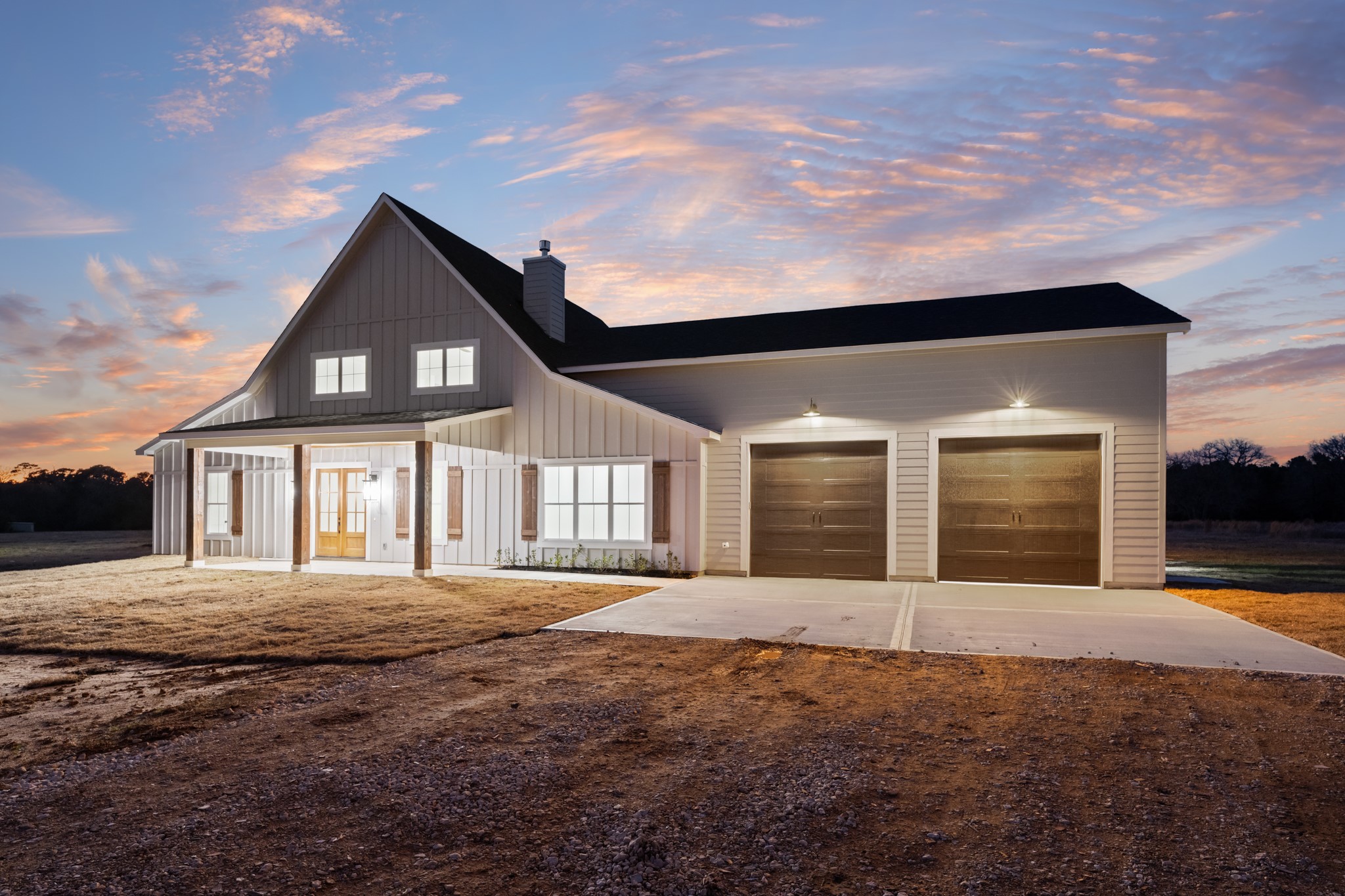 95 Longhorn Loop New Waverly, TX 77358 - Photo 41 of 50 a front view of a house with a yard and garage
