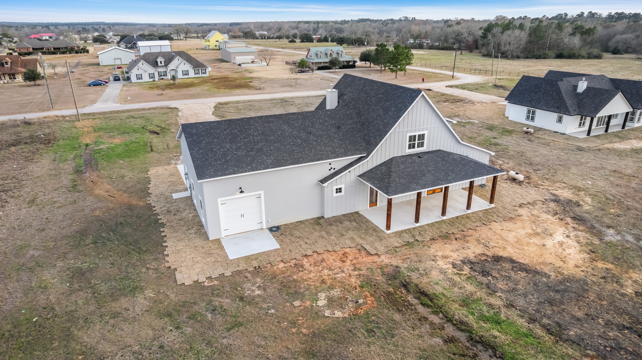 95 Longhorn Loop New Waverly, TX 77358 - Photo 49 of 50 an aerial view of a house with a yard and lake view