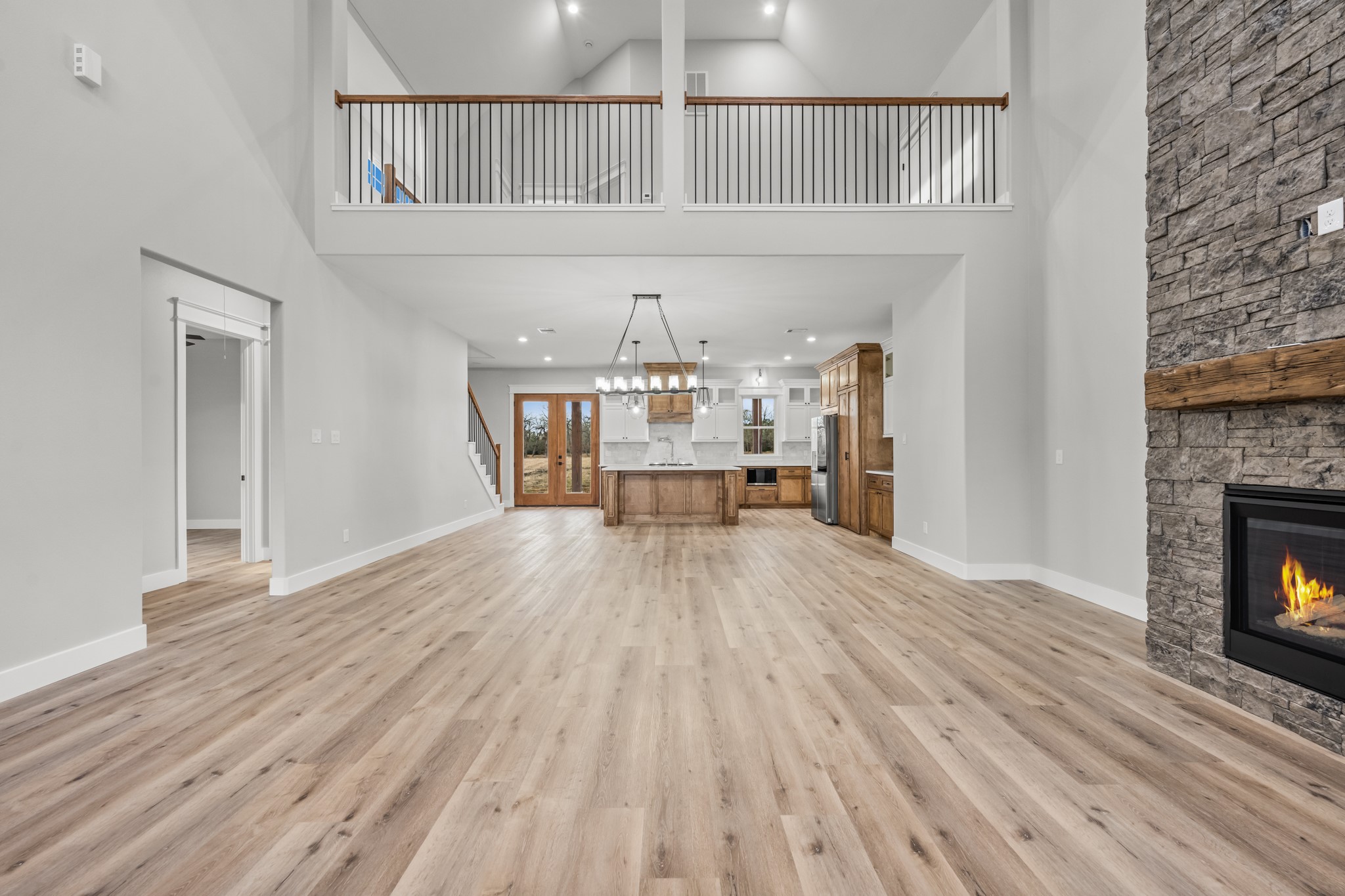 95 Longhorn Loop New Waverly, TX 77358 - Photo 7 of 50 a view of a livingroom with wooden floor and a fireplace