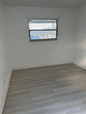 a kitchen with granite countertop stainless steel appliances a refrigerator and stove