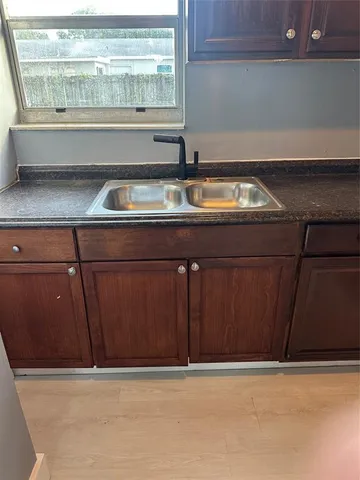 a white refrigerator freezer sitting in a kitchen