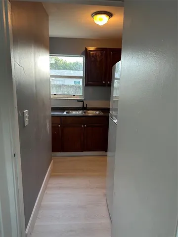 a white toilet sitting next to a sink