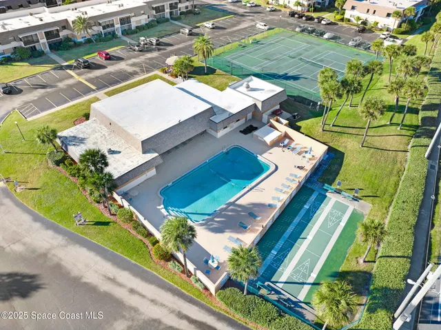 an aerial view of a house with a ocean view