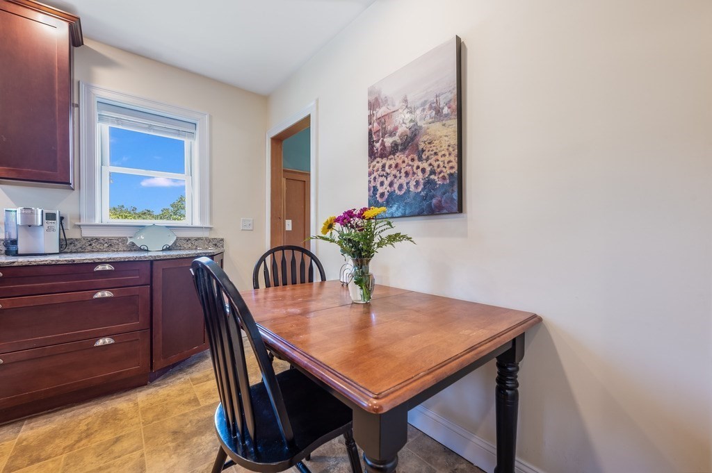 55 Paul Street Watertown, MA 02472 - Photo 14 of 42 a view of a dining room with furniture
