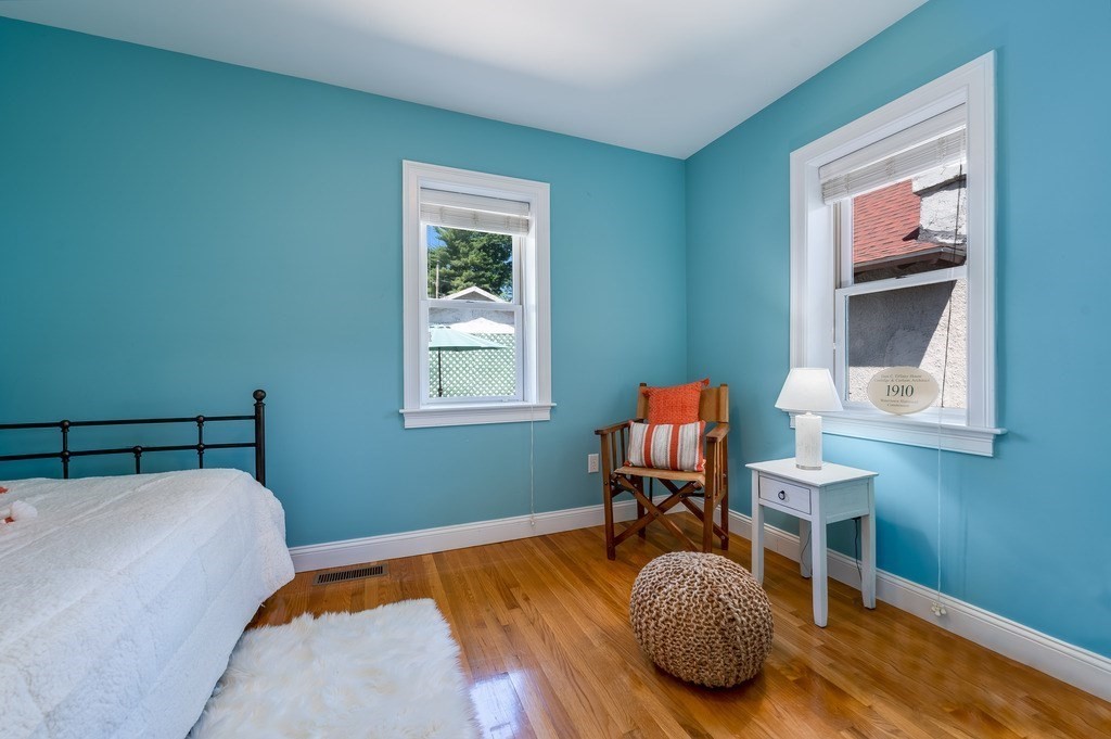 55 Paul Street Watertown, MA 02472 - Photo 21 of 42 a bedroom with a bed and a window