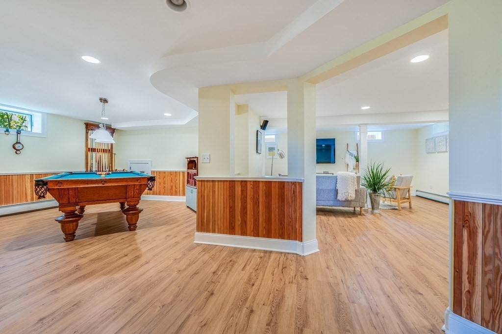 55 Paul Street Watertown, MA 02472 - Photo 32 of 42 a living room with furniture and wooden floor
