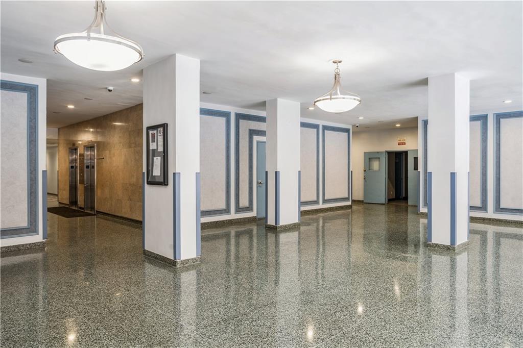 2944 West 5th Street, Unit 14F Brooklyn, NY 11224 - Photo 13 of 13 a view of a hallway with a chandelier