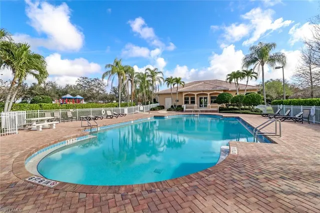 a view of a swimming pool with a lounge chairs