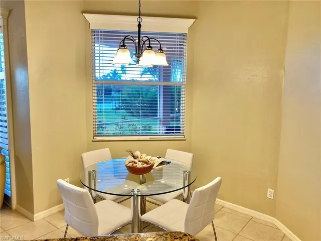 a view of a dining room with furniture and window