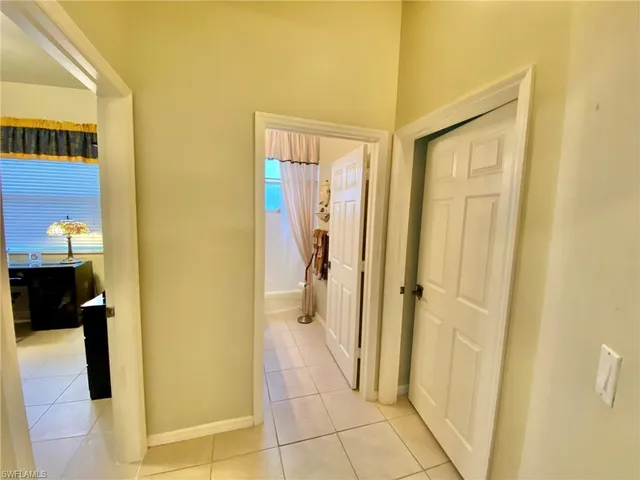 a view of a bathroom from a corridor