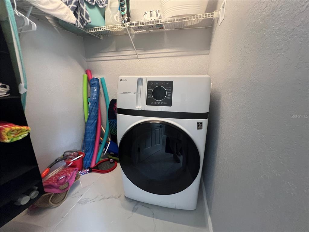 2704 2nd Street, Unit 7 Indian Rocks Beach, FL 33785 - Photo 22 of 32 a utility room with dryer and washer