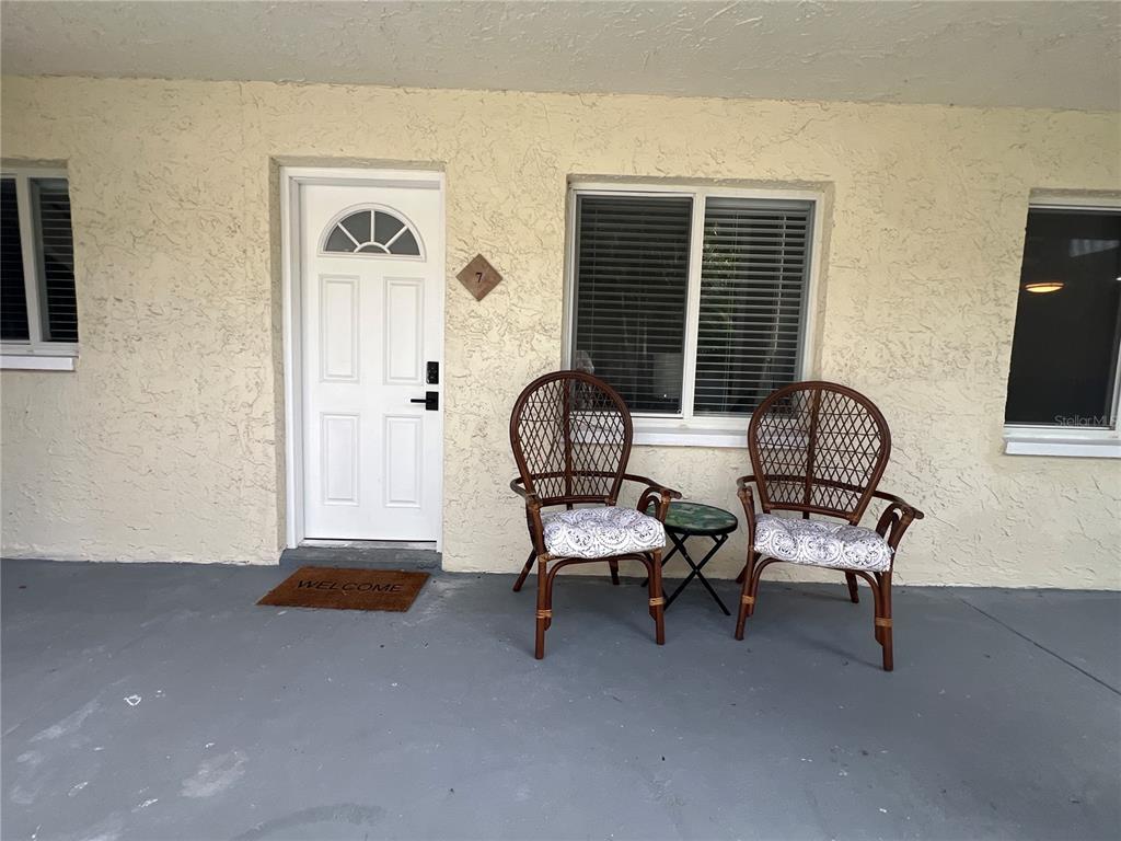 2704 2nd Street, Unit 7 Indian Rocks Beach, FL 33785 - Photo 3 of 32 a living room with furniture and a window