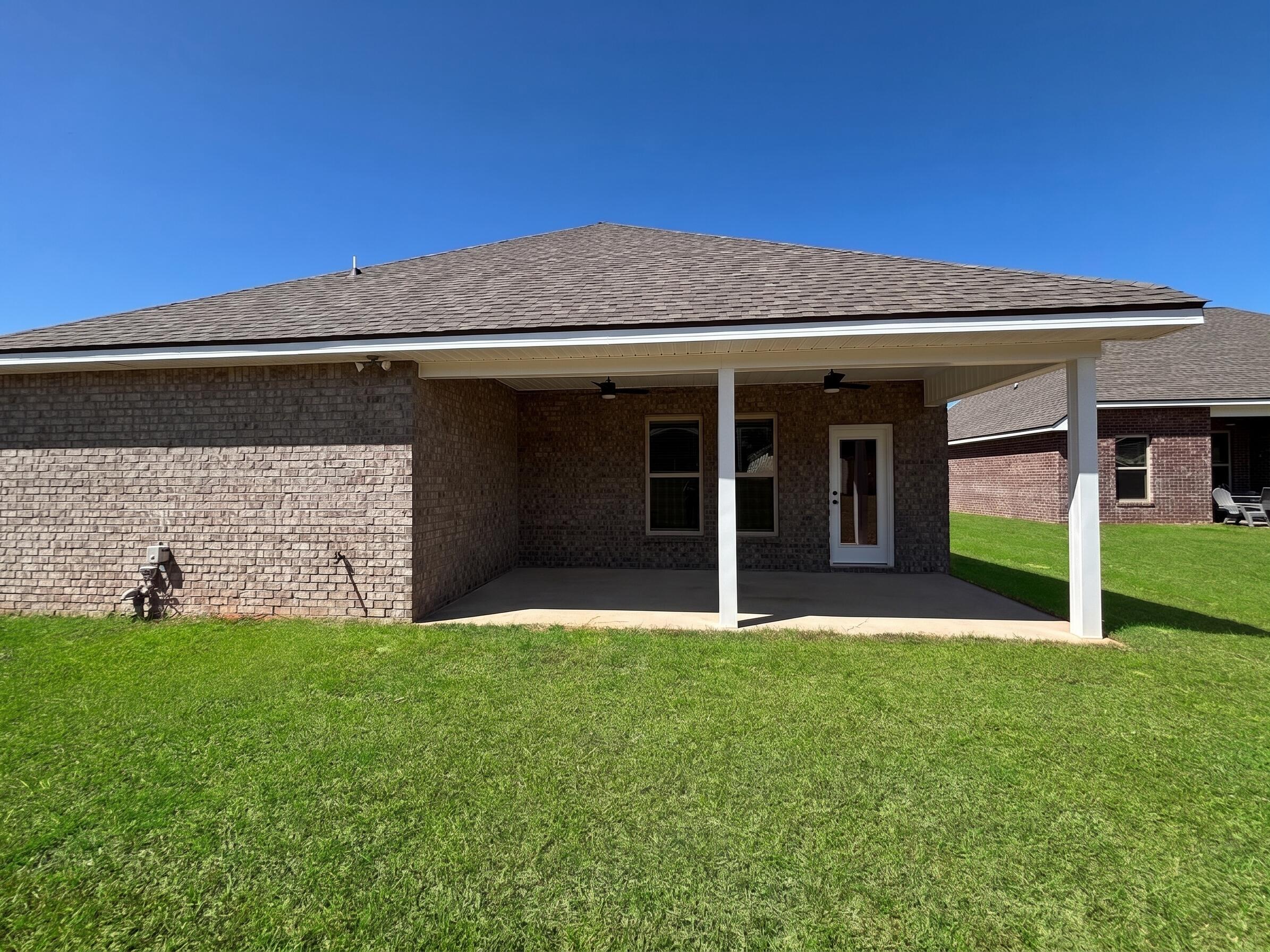 2731 Louis Circle Crestview, FL 32536 - Photo 15 of 17 a view of a backyard with a garden and plants