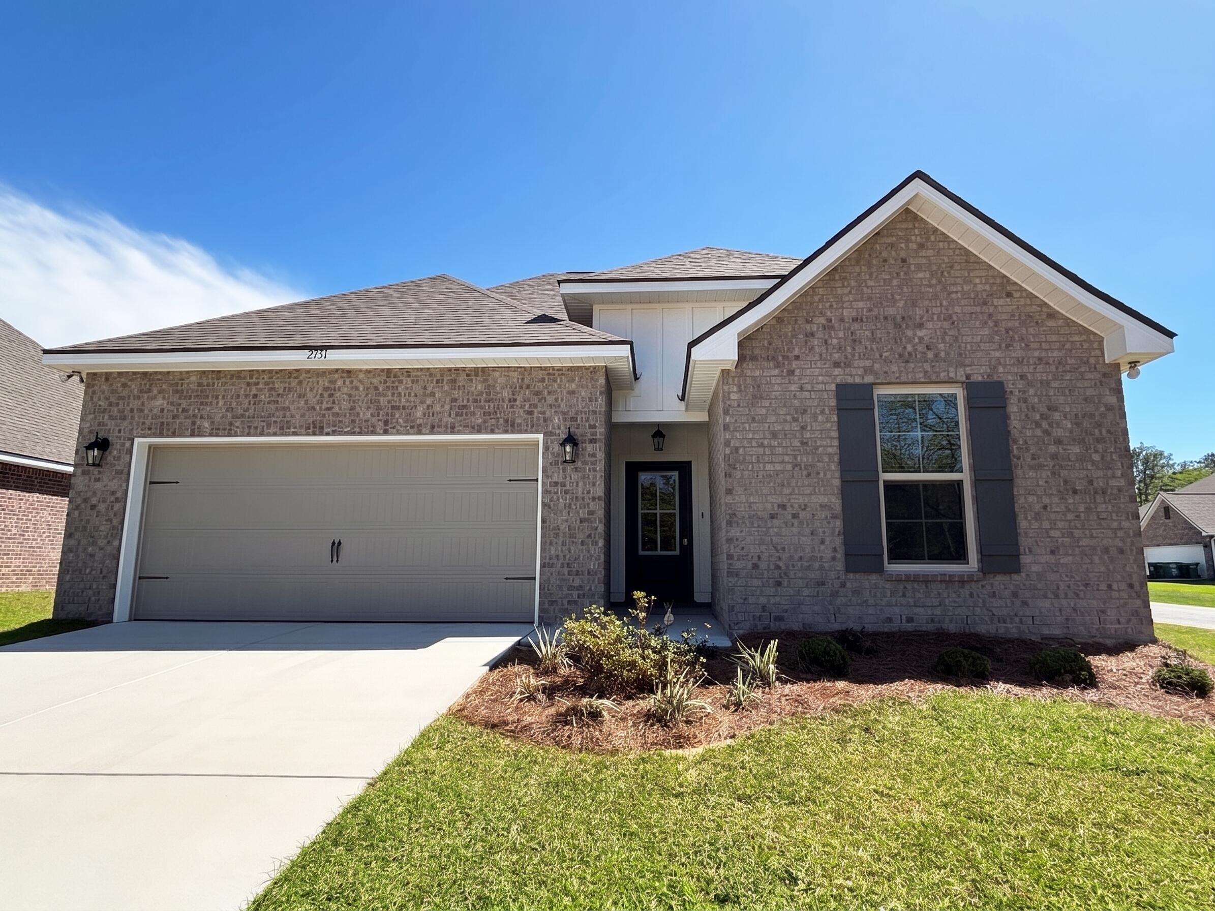 2731 Louis Circle Crestview, FL 32536 - Photo 2 of 17 a front view of a house with a yard