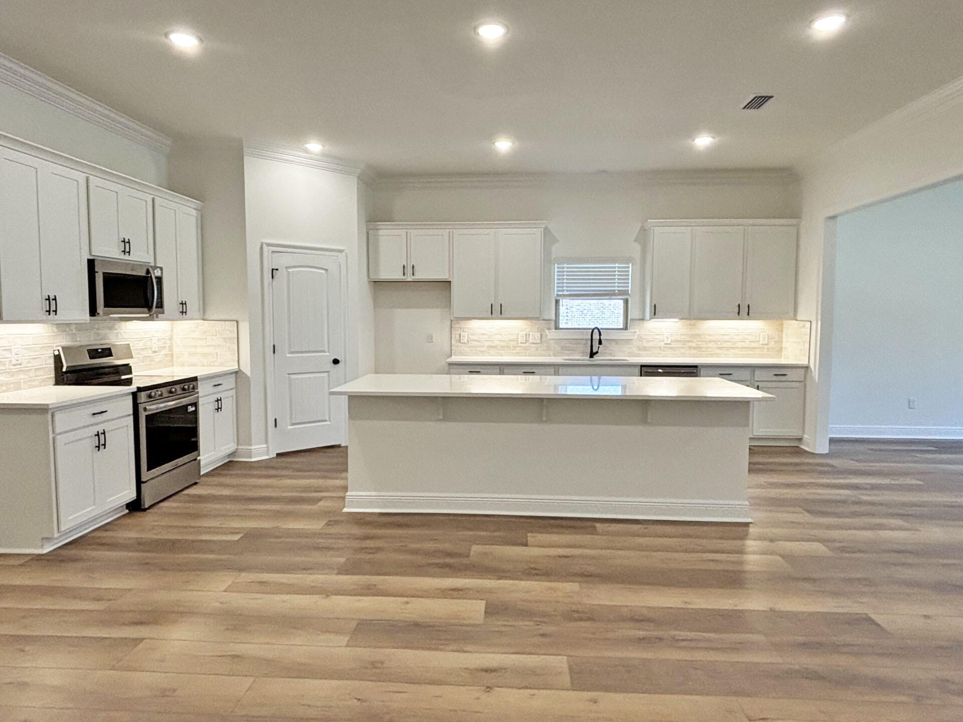 2731 Louis Circle Crestview, FL 32536 - Photo 4 of 17 a view of kitchen with wooden floor