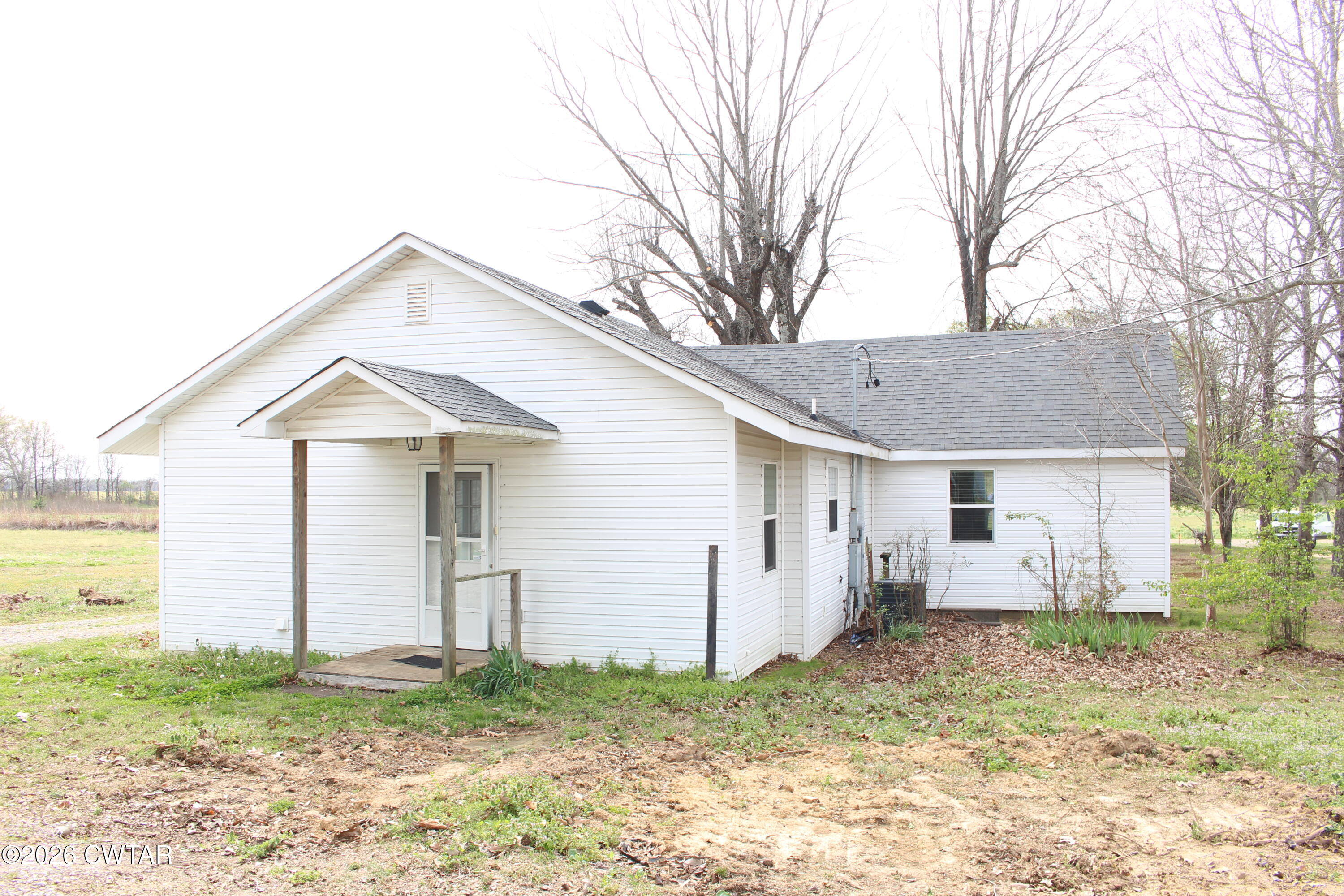 8860 Highway 138 Mercer, TN 38392 - Photo 21 of 23 a view of a house with a yard