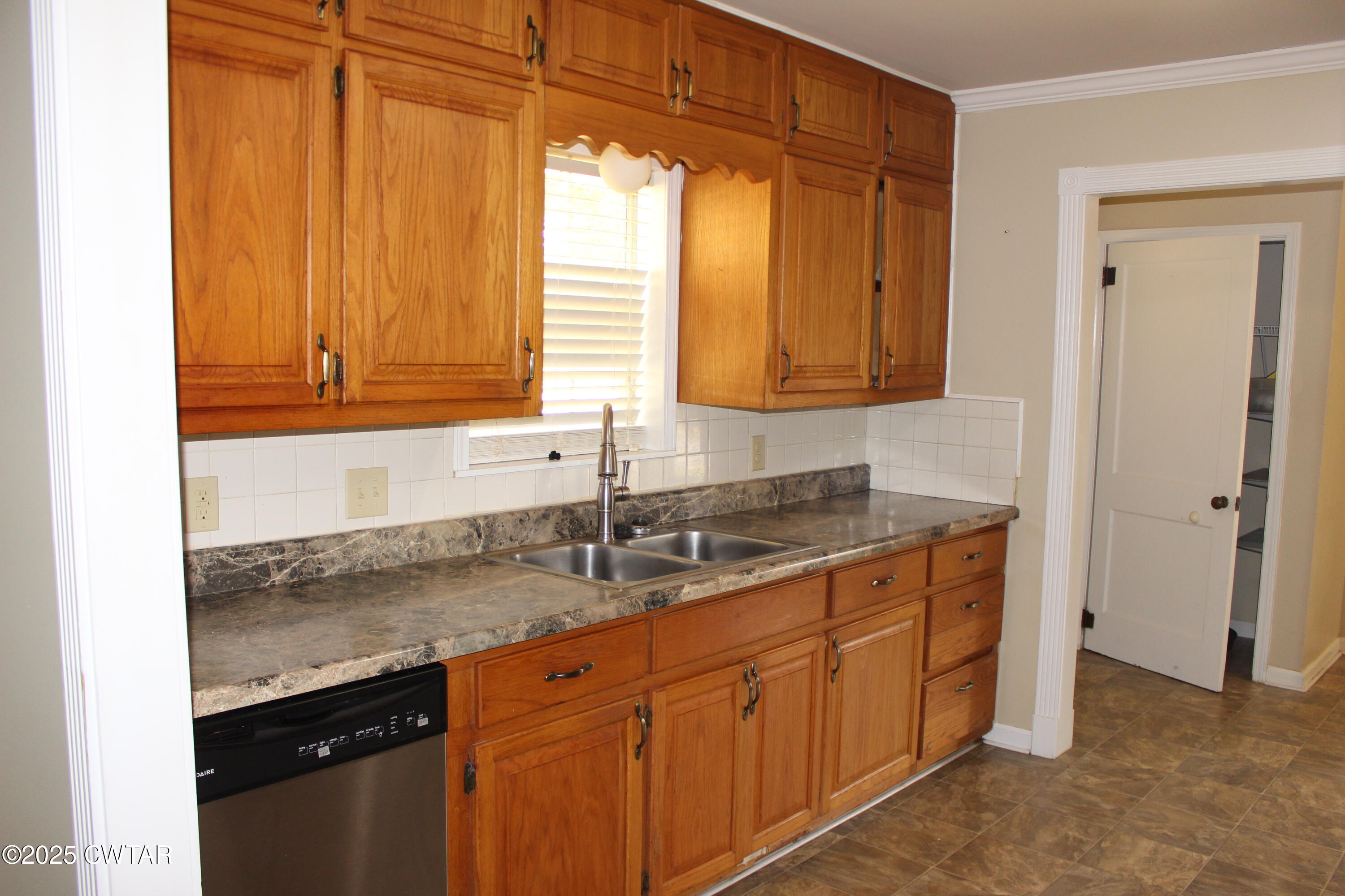 8860 Highway 138 Mercer, TN 38392 - Photo 8 of 23 a kitchen with stainless steel appliances granite countertop a sink and a cabinets