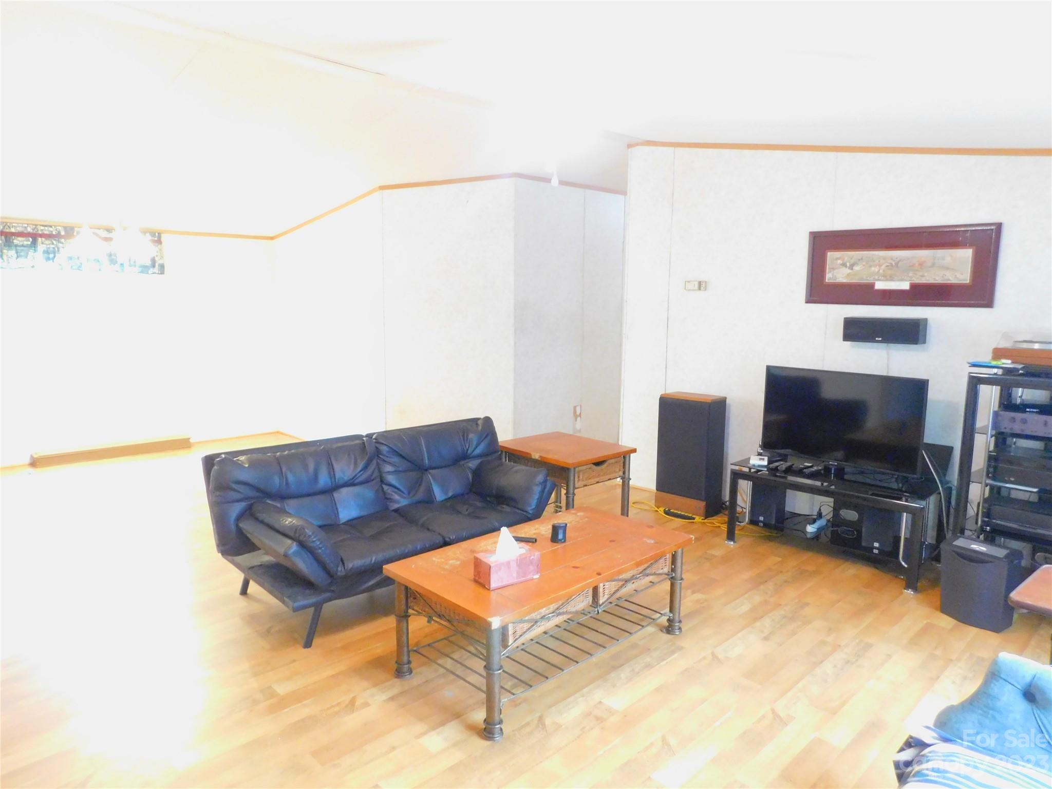 1642 Springlake Road York, SC 29745 - Photo 12 of 30 a living room with furniture and a flat screen tv