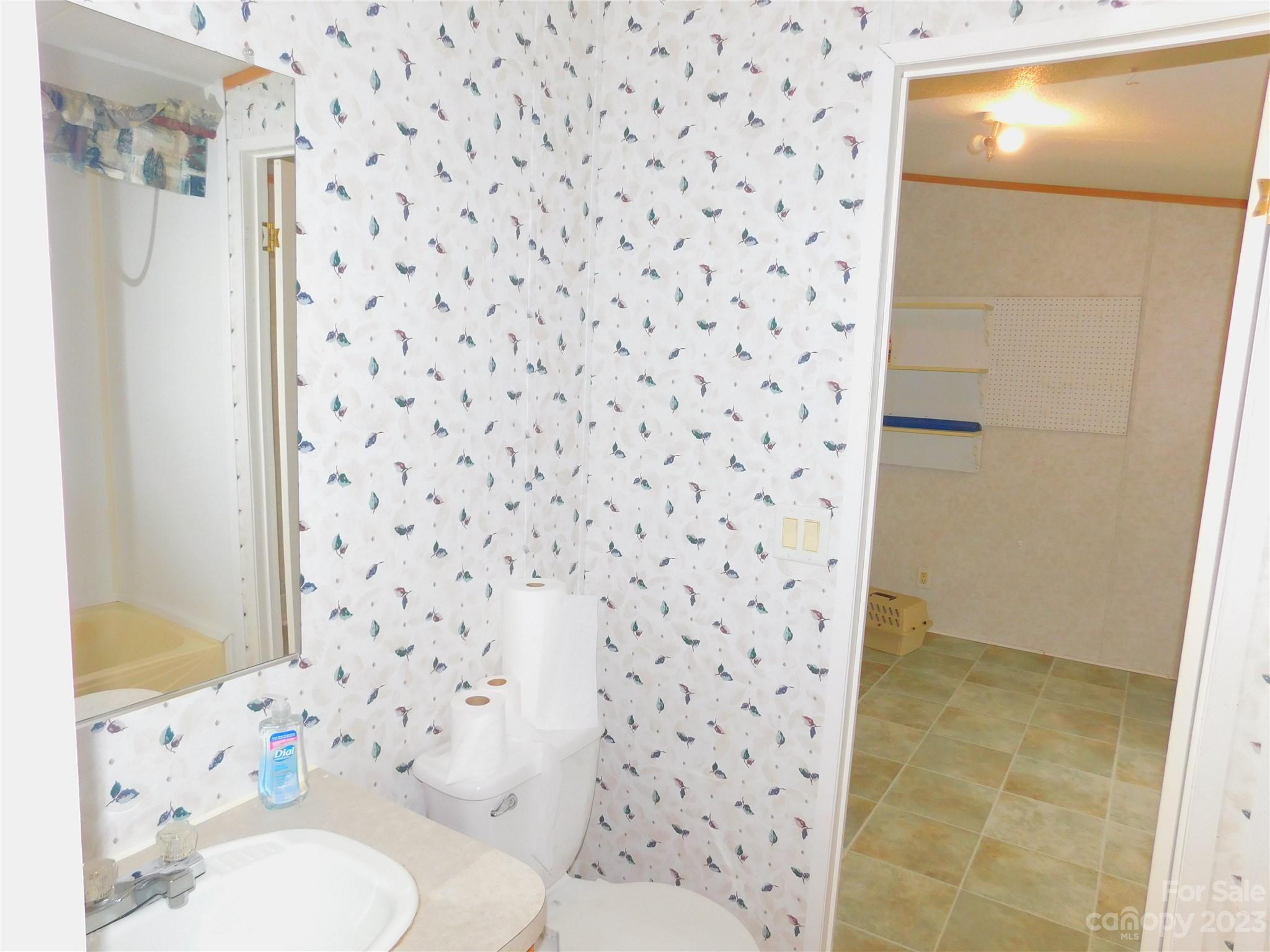 1642 Springlake Road York, SC 29745 - Photo 27 of 30 a bathroom with a toilet and a shower curtain