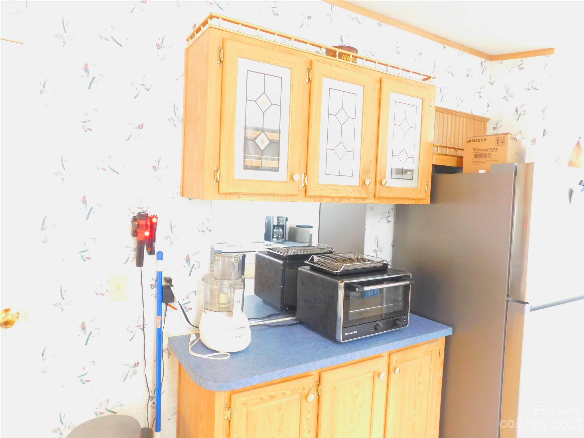 1642 Springlake Road York, SC 29745 - Photo 8 of 30 a kitchen with stainless steel appliances granite countertop a sink and a stove next to a window