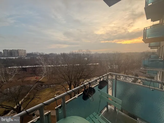 a view of a balcony with lake view and mountain view