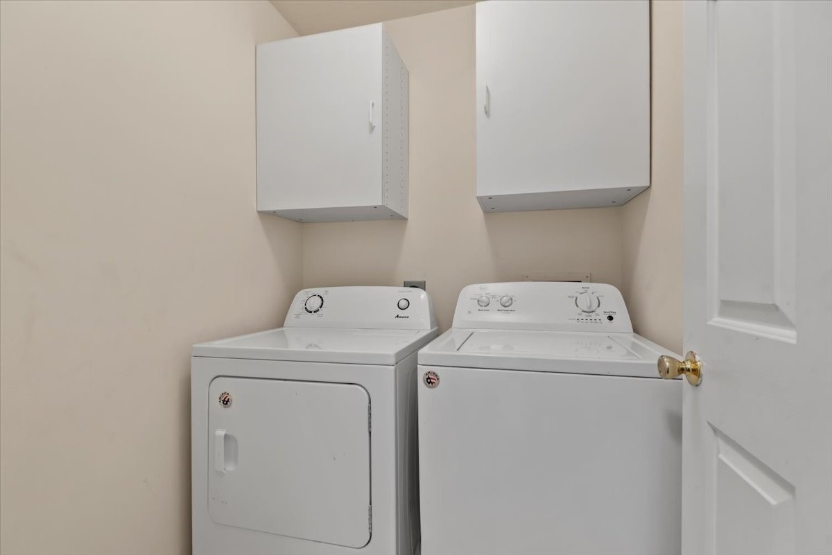 22711 Tree House Lane Spring, TX 77373 - Photo 22 of 28 a utility room with dryer and washer