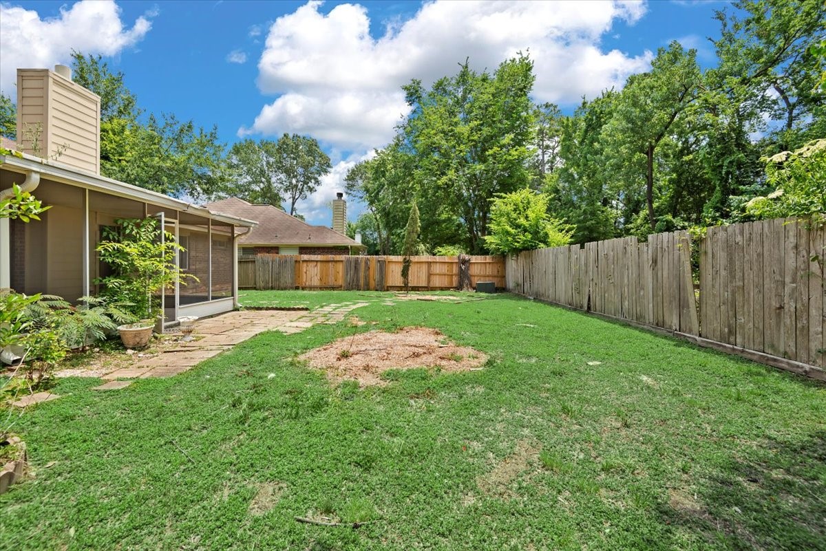 22711 Tree House Lane Spring, TX 77373 - Photo 24 of 28 a view of yard with small swimming pool and garden