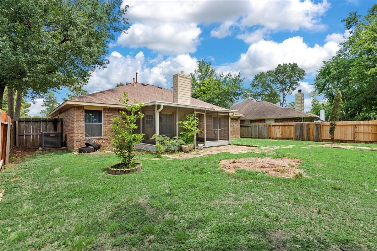 22711 Tree House Lane Spring, TX 77373 - Photo 25 of 28 a front view of house with yard and green space