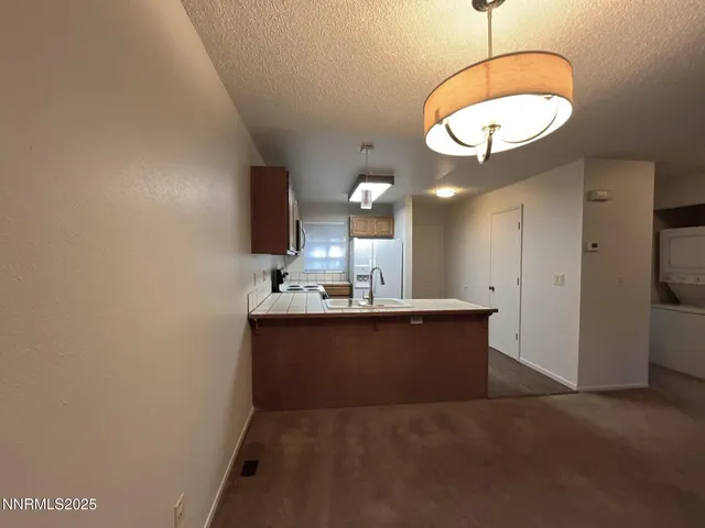 a view of kitchen and a window