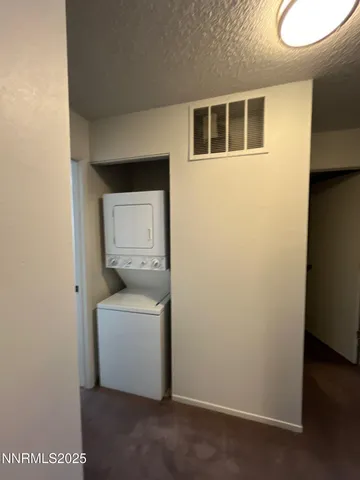 a utility room with a sink dryer and washer
