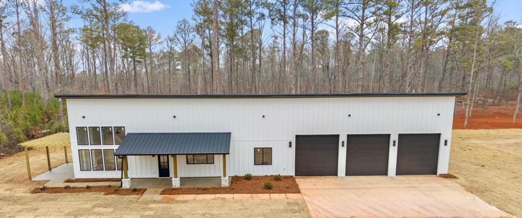 419 Lively Road Waco, GA 30182 - Photo 1 of 48 a front view of a house with yard