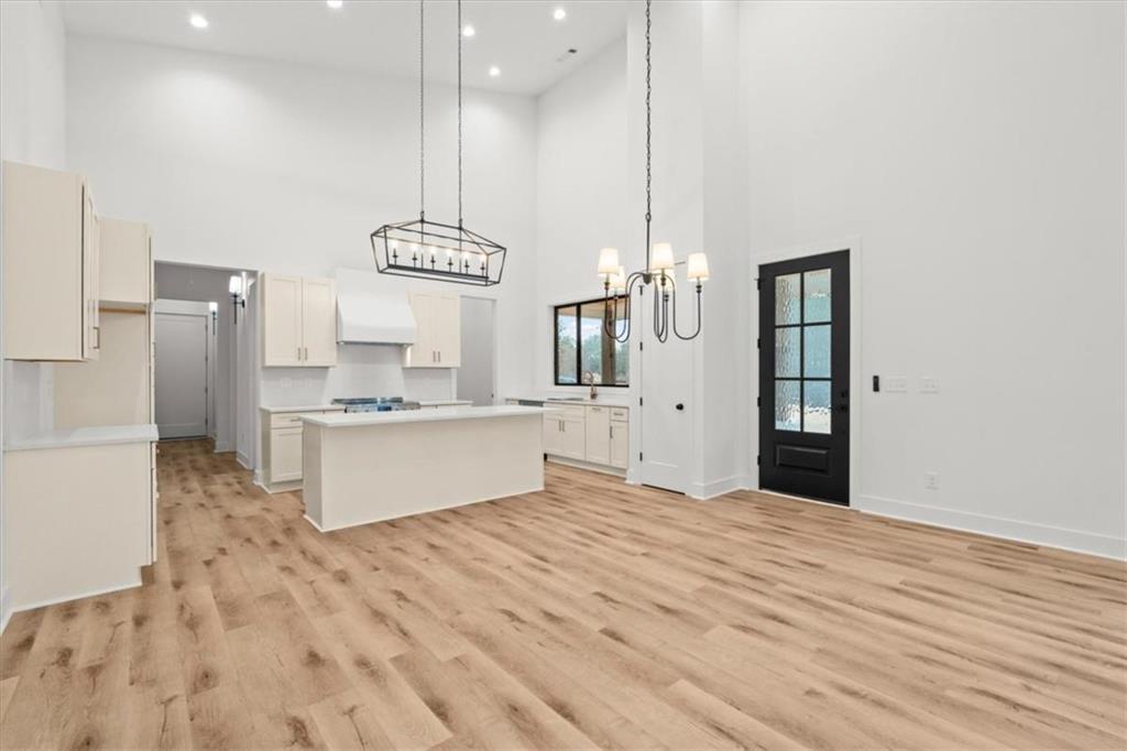 419 Lively Road Waco, GA 30182 - Photo 17 of 48 a large kitchen with kitchen island white cabinets and stainless steel appliances