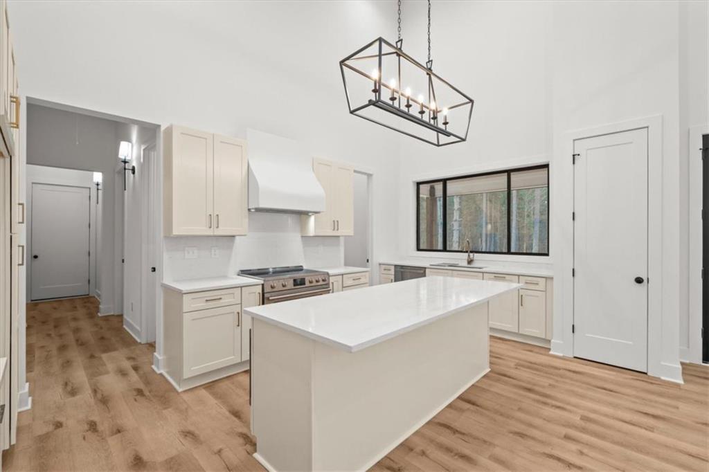 419 Lively Road Waco, GA 30182 - Photo 18 of 48 a large white kitchen with a stove a sink and dishwasher