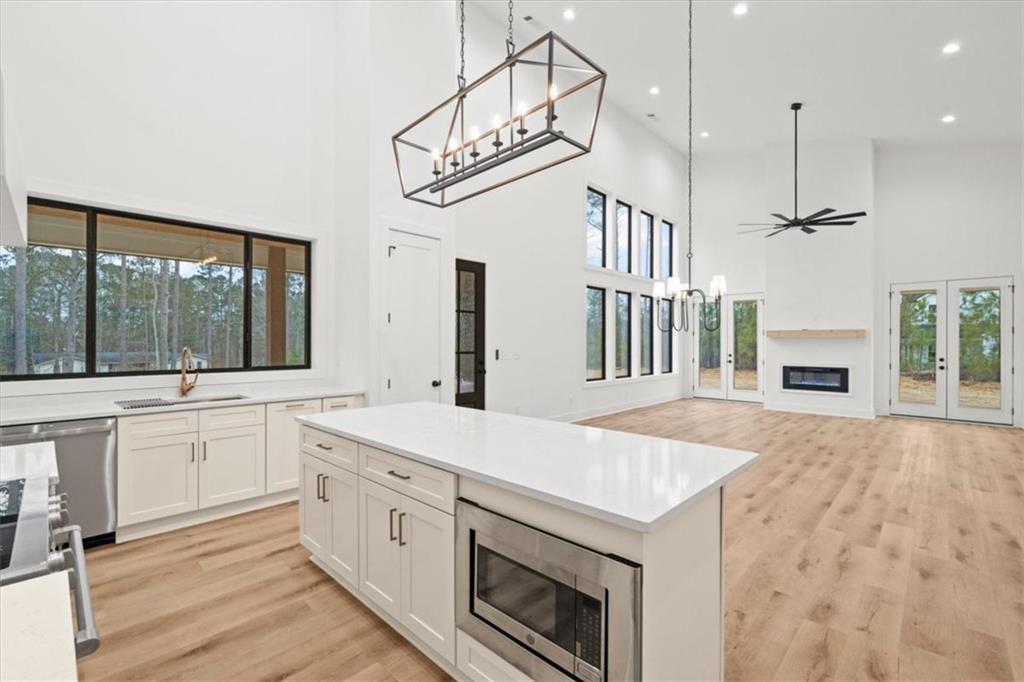 419 Lively Road Waco, GA 30182 - Photo 19 of 48 a kitchen with a stove a sink and a refrigerator