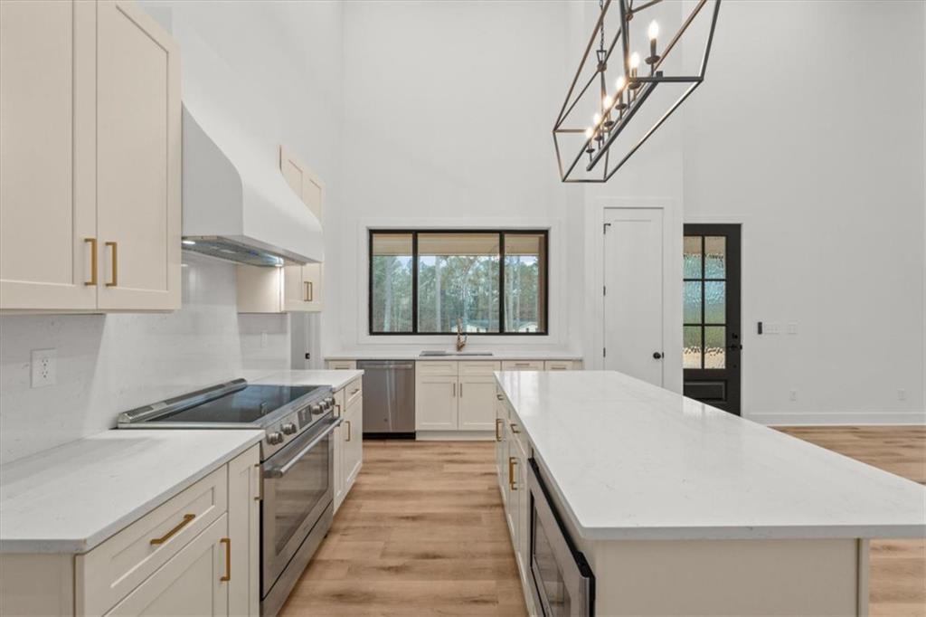419 Lively Road Waco, GA 30182 - Photo 20 of 48 a kitchen with stainless steel appliances a stove a sink and cabinets