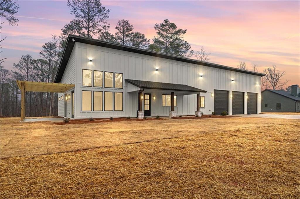419 Lively Road Waco, GA 30182 - Photo 3 of 48 a view of a house with a yard and garage