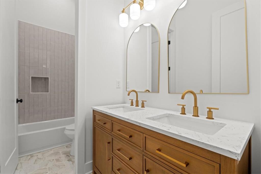 419 Lively Road Waco, GA 30182 - Photo 37 of 48 a bathroom with a sink a toilet and shower