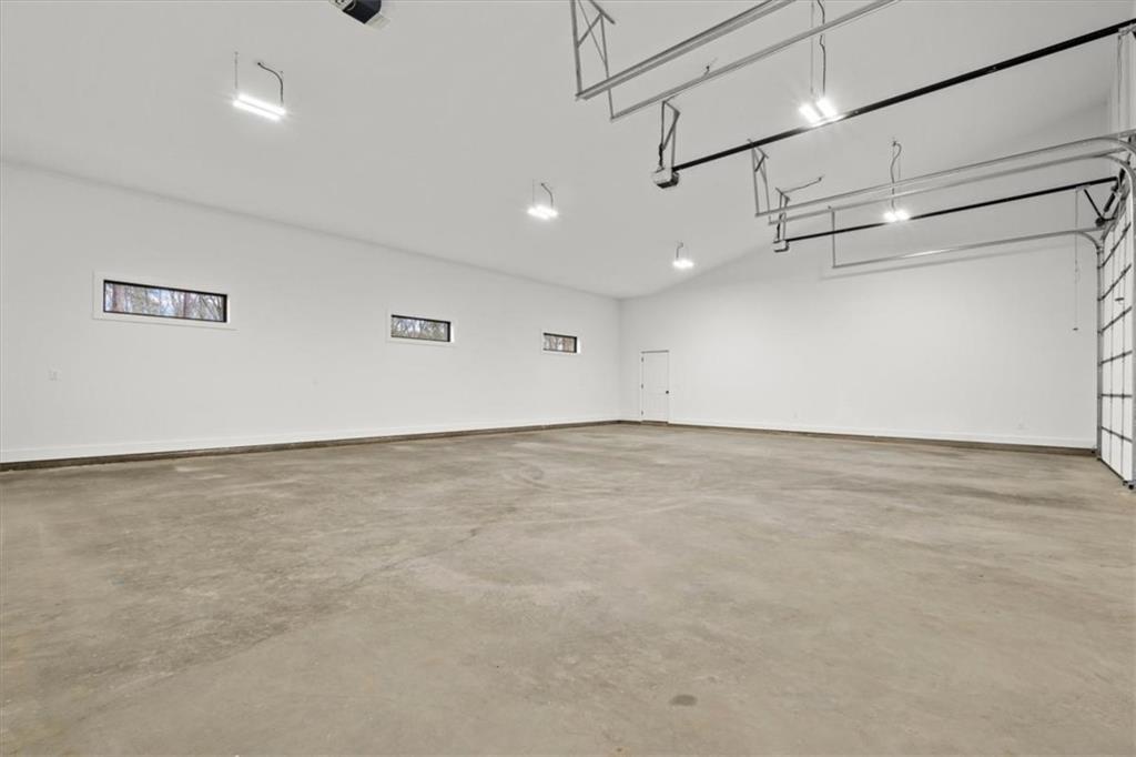 419 Lively Road Waco, GA 30182 - Photo 39 of 48 an empty room with wooden floor and windows