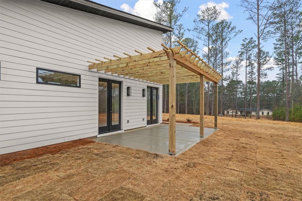 419 Lively Road Waco, GA 30182 - Photo 42 of 48 a backyard of a house with a table and chairs