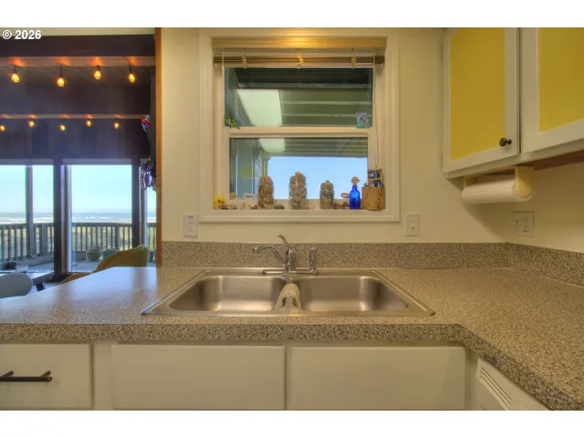 a kitchen with a sink and a window