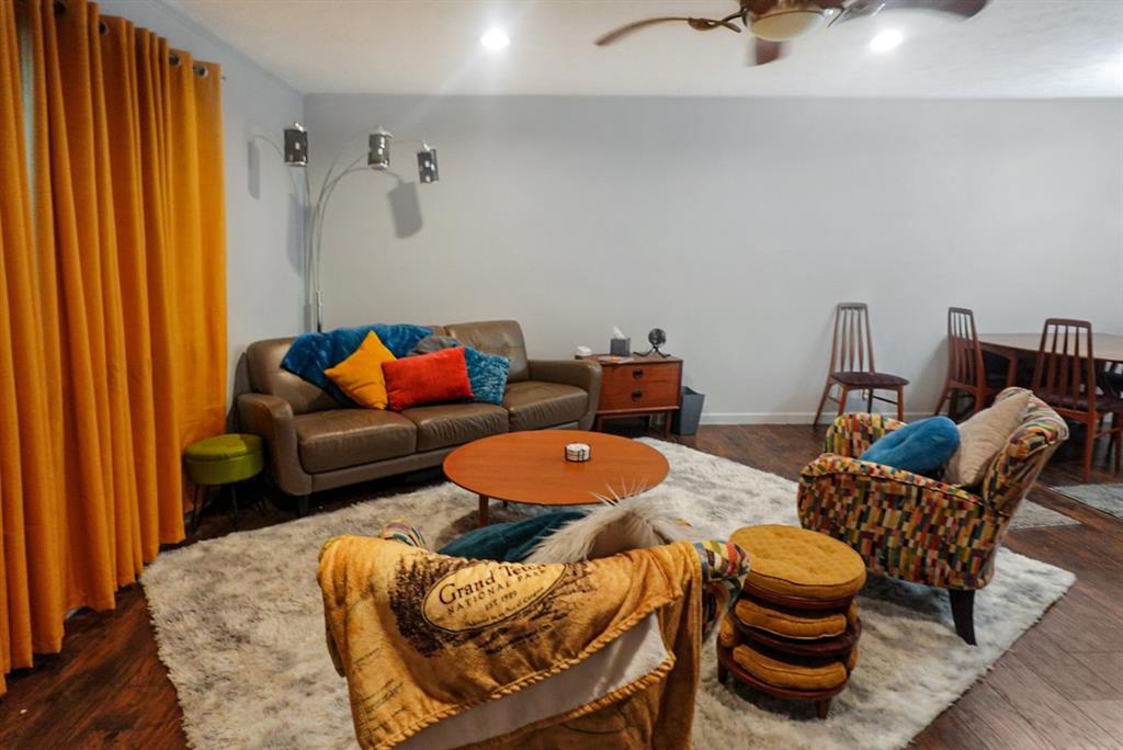 403 West Tarleton Street Stephenville, TX 76401 - Photo 4 of 19 a dining room with furniture and wooden floor