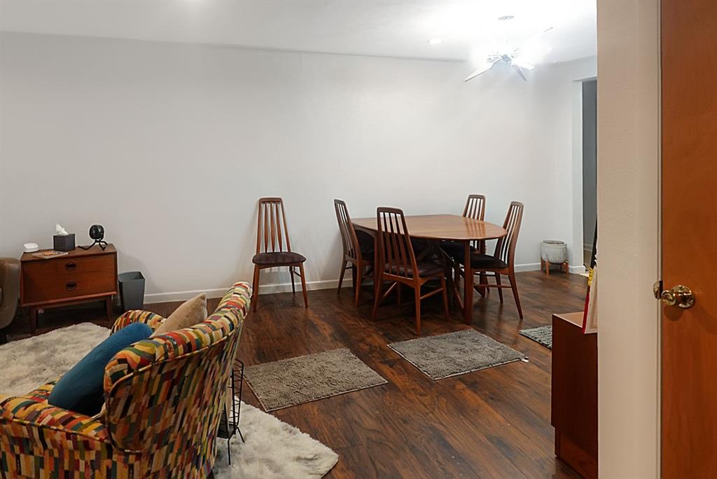403 West Tarleton Street Stephenville, TX 76401 - Photo 5 of 19 a view of a dining room with furniture and wooden floor