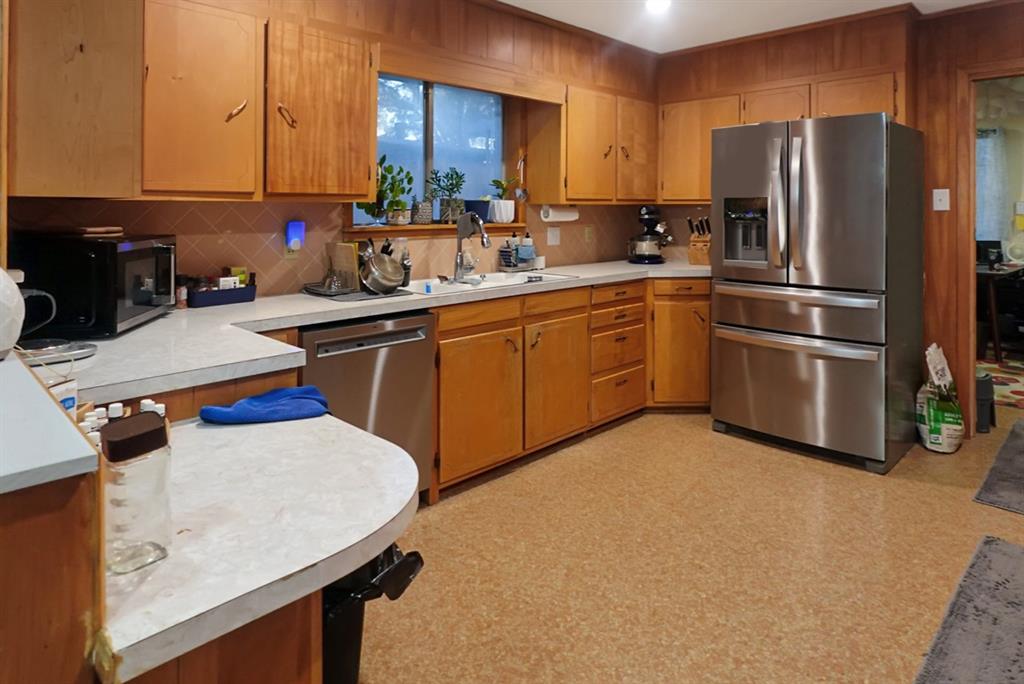403 West Tarleton Street Stephenville, TX 76401 - Photo 6 of 19 a kitchen with a sink appliances and cabinets