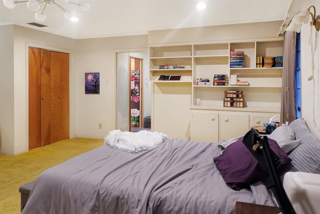 403 West Tarleton Street Stephenville, TX 76401 - Photo 10 of 19 a bedroom with a bed and closet