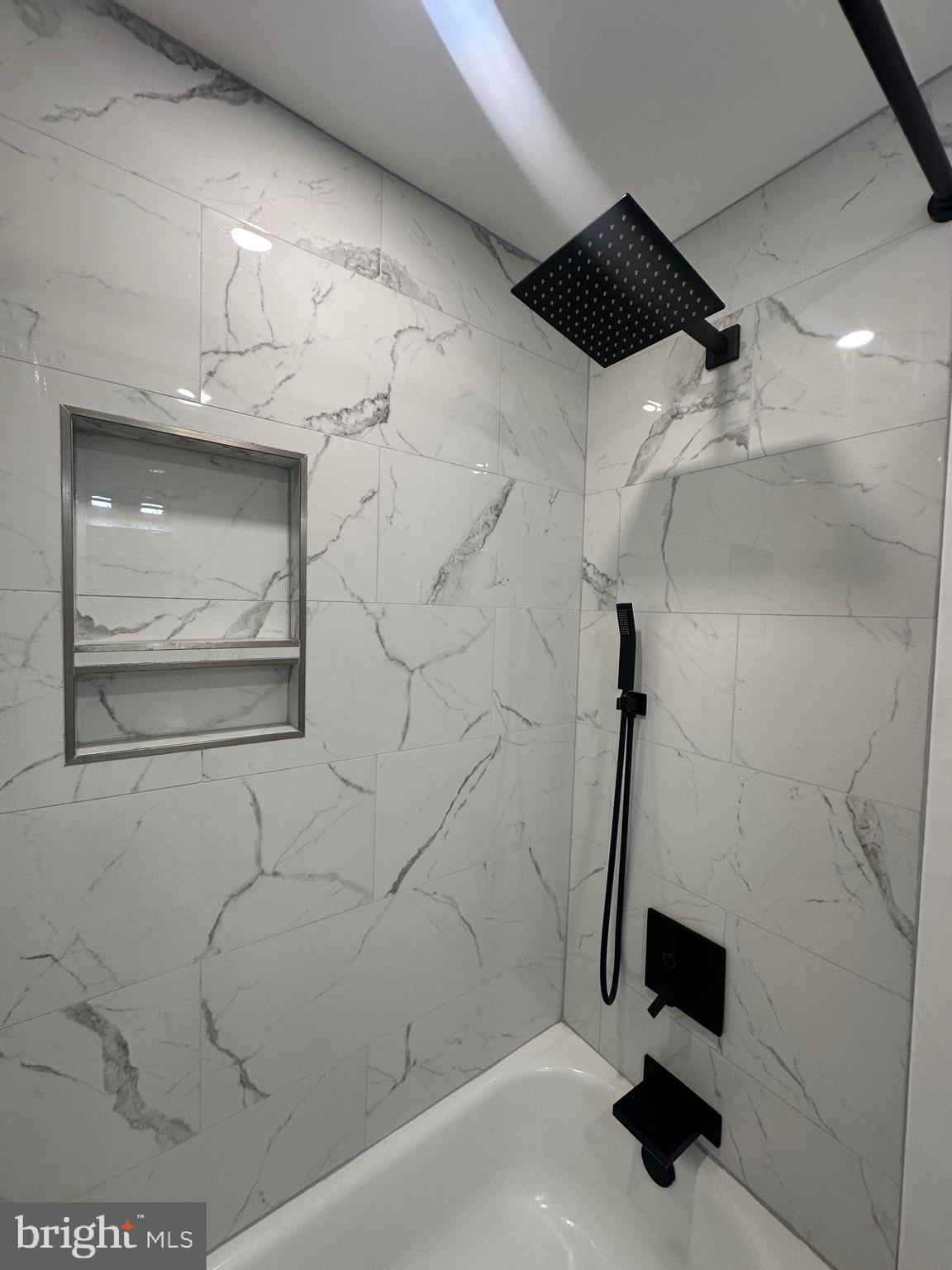 9405 Kirkwood Road Philadelphia, PA 19114 - Photo 19 of 66 a bathroom with a bathtub and shower