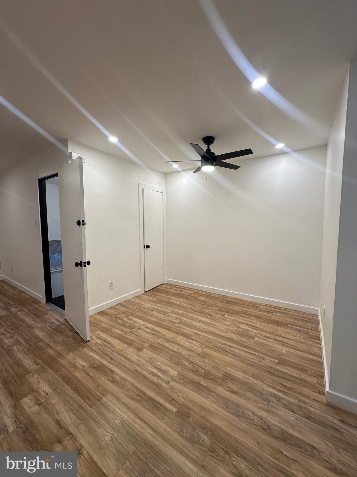 9405 Kirkwood Road Philadelphia, PA 19114 - Photo 40 of 66 a view of an empty room with wooden floor