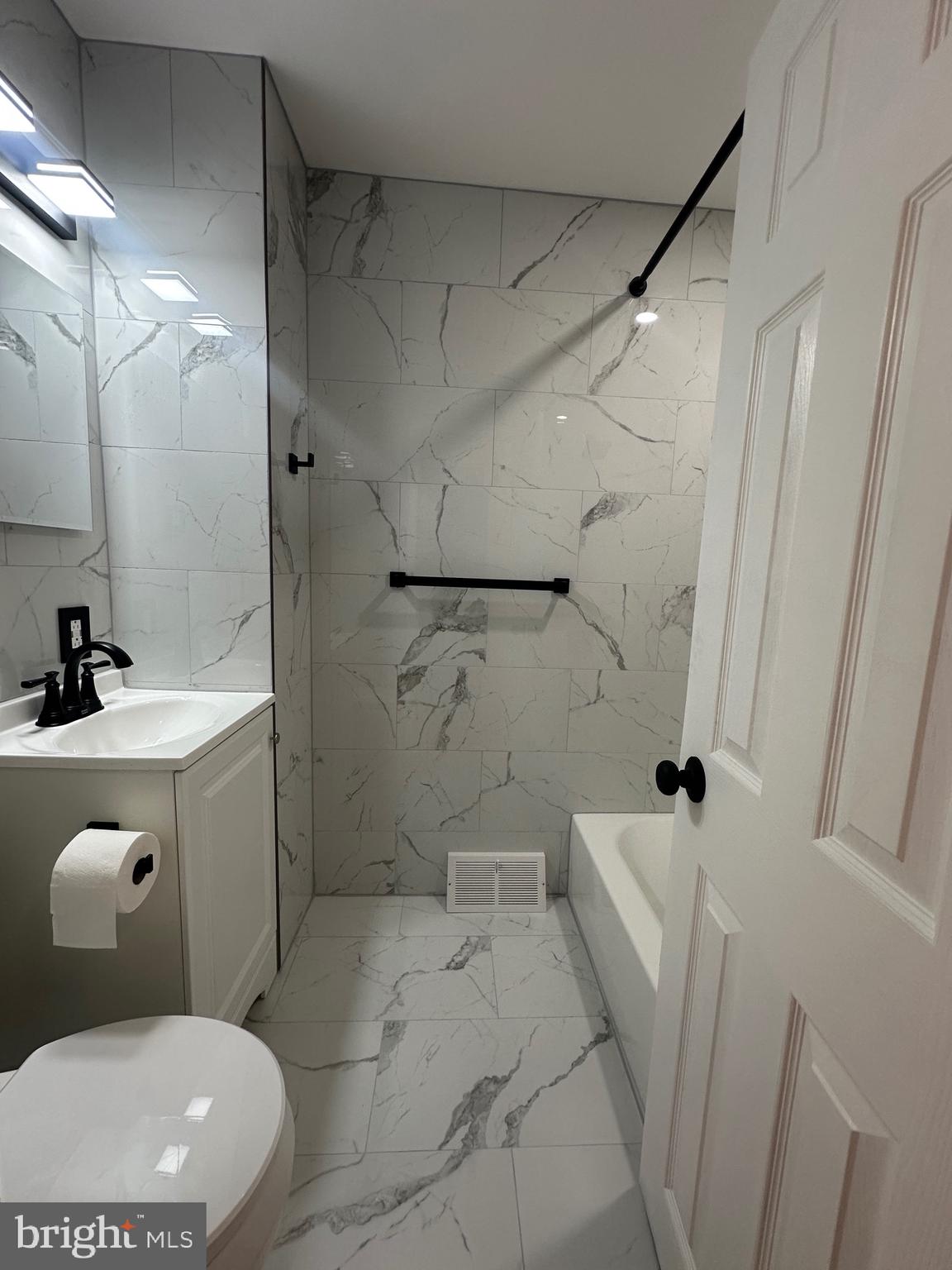 9405 Kirkwood Road Philadelphia, PA 19114 - Photo 44 of 66 a bathroom with a sink toilet and shower