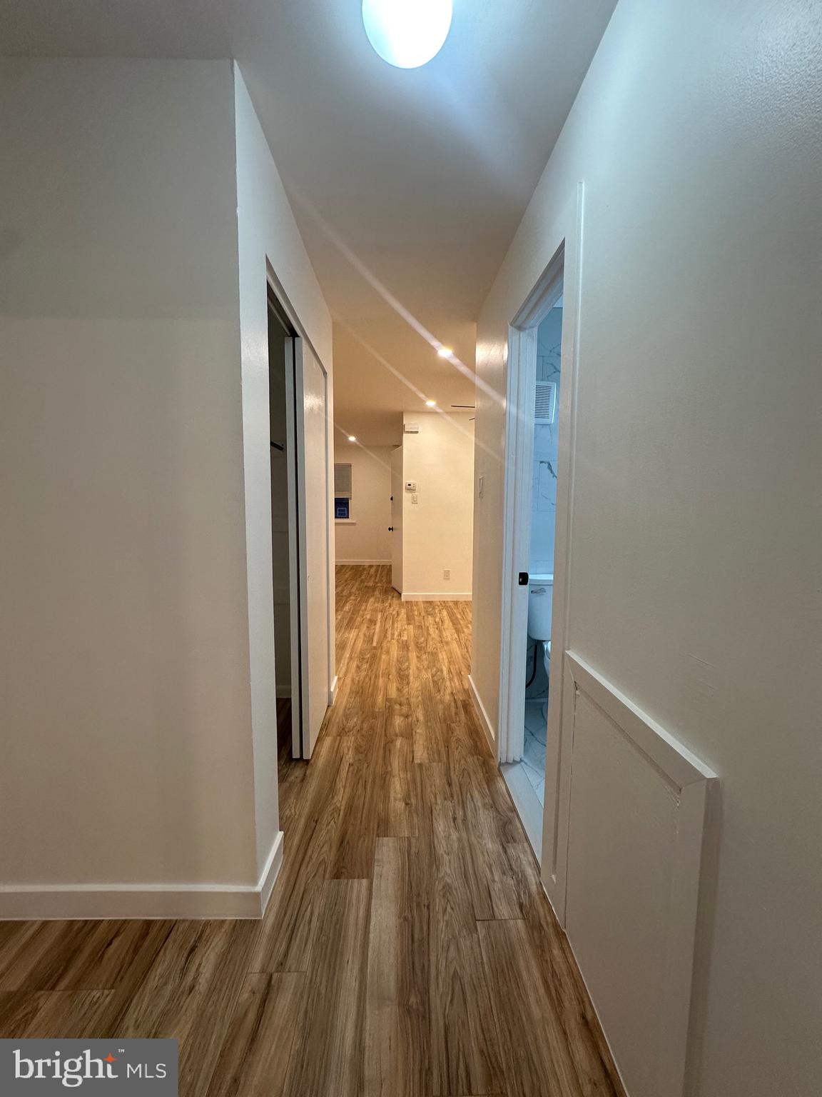 9405 Kirkwood Road Philadelphia, PA 19114 - Photo 45 of 66 a view of a hallway with wooden floor