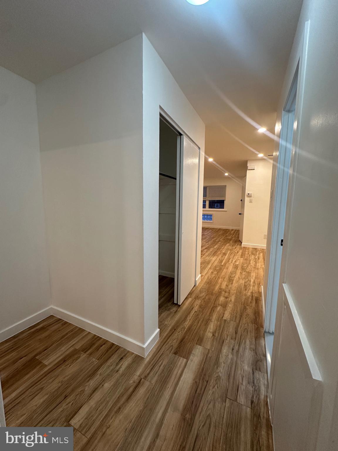 9405 Kirkwood Road Philadelphia, PA 19114 - Photo 46 of 66 a view of a hallway with wooden floor