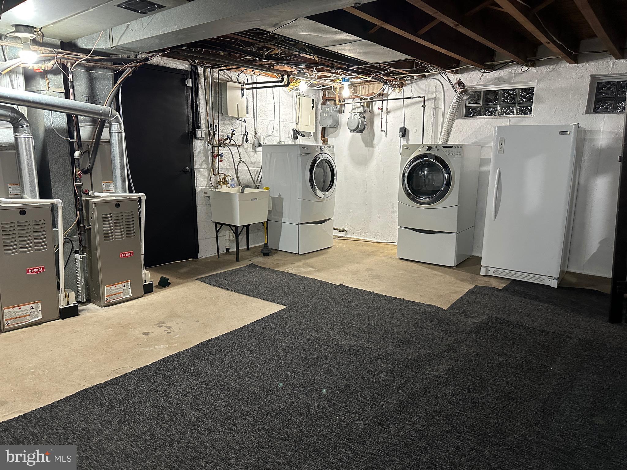 9405 Kirkwood Road Philadelphia, PA 19114 - Photo 59 of 66 a view of a storage & utility room with washer and dryer